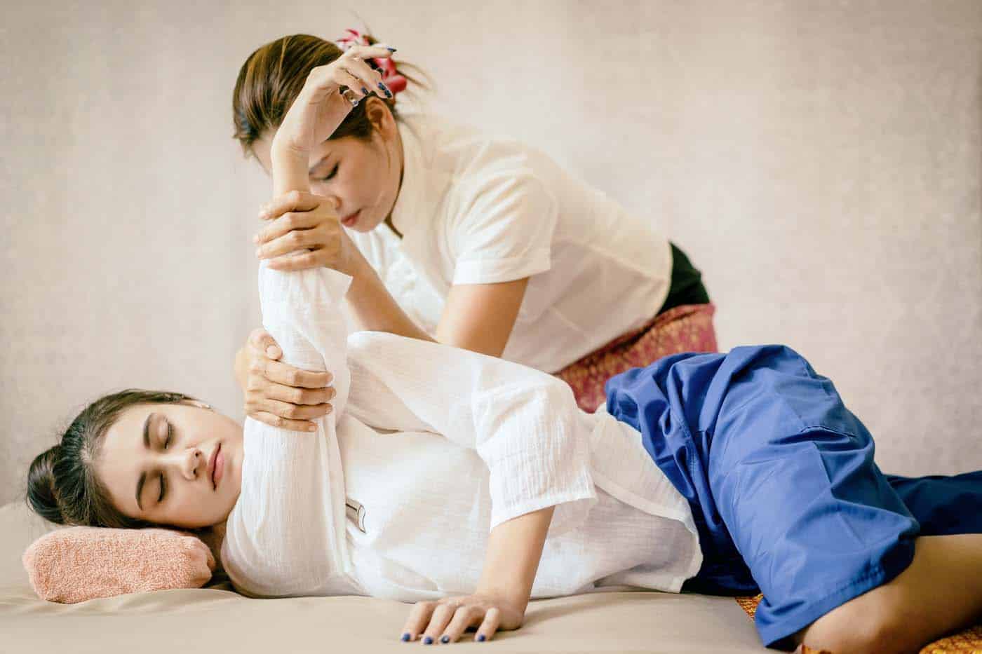 Women is getting Thai Massage Spa stretching